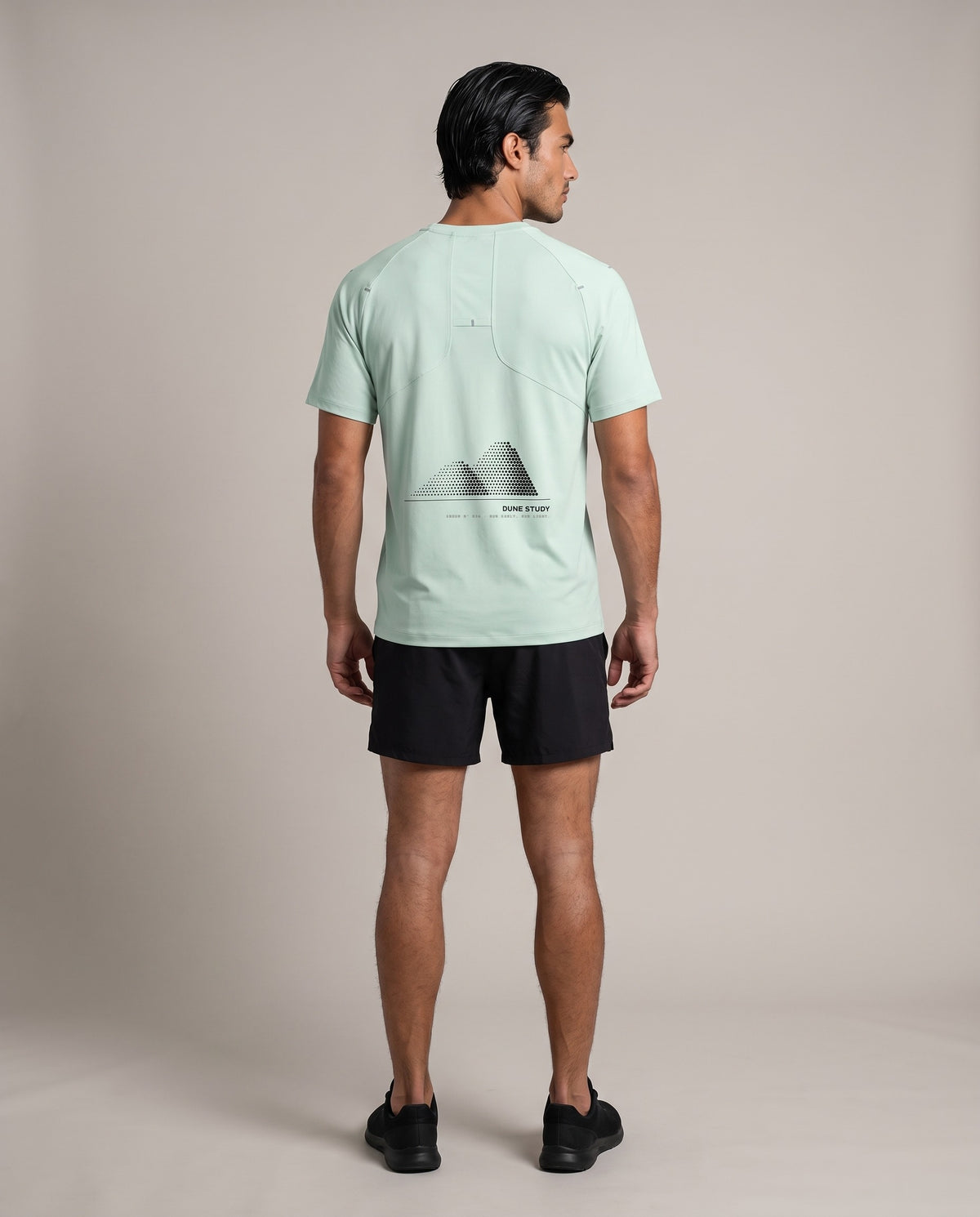 Dune Dots Run Tee — Light Green & Light Apricot, back, worn by an ENDUR model
