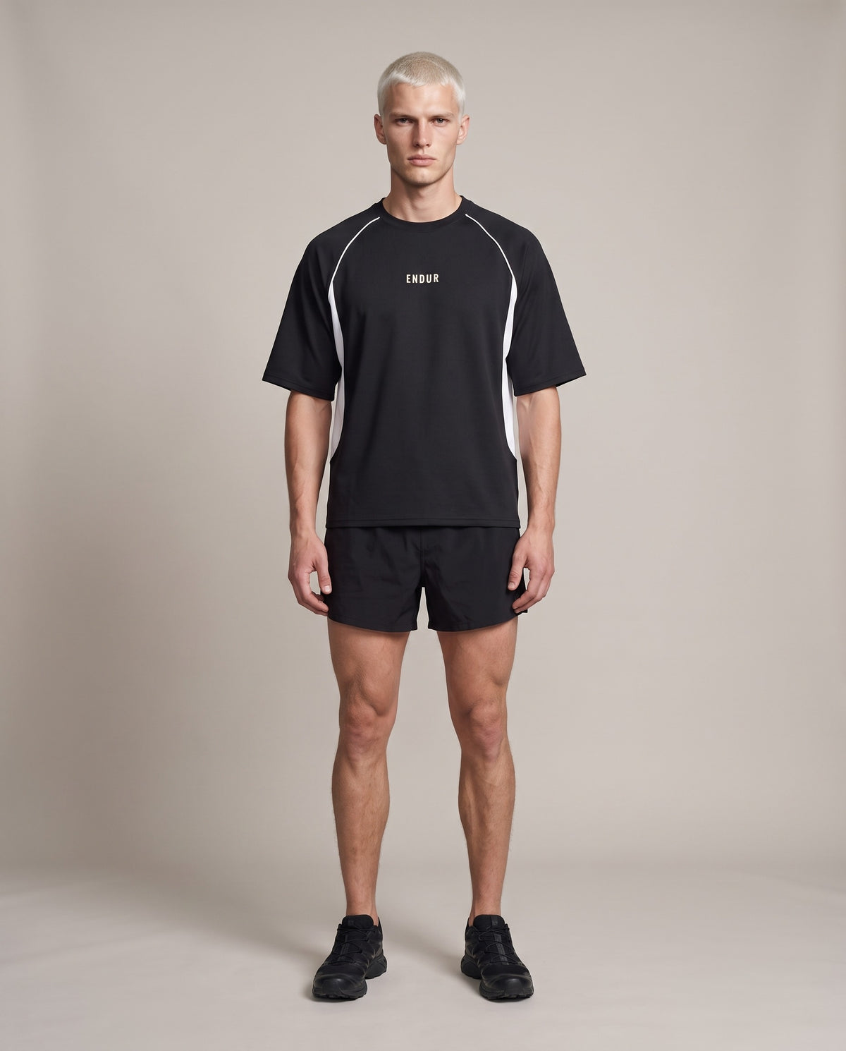 Hafeet Trail Tee HFT-1249 — Black & Dark Gray, front, worn by an ENDUR model