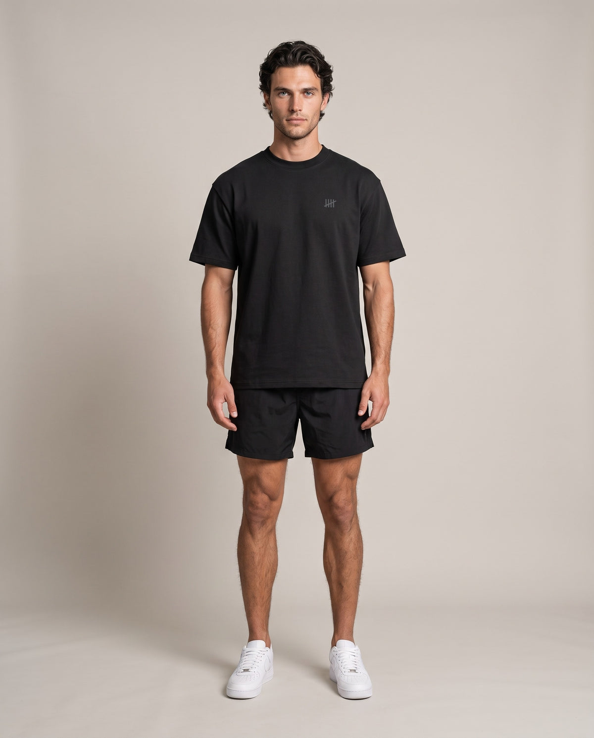 Reason Tee DR-01 — Black, front, worn by an ENDUR model