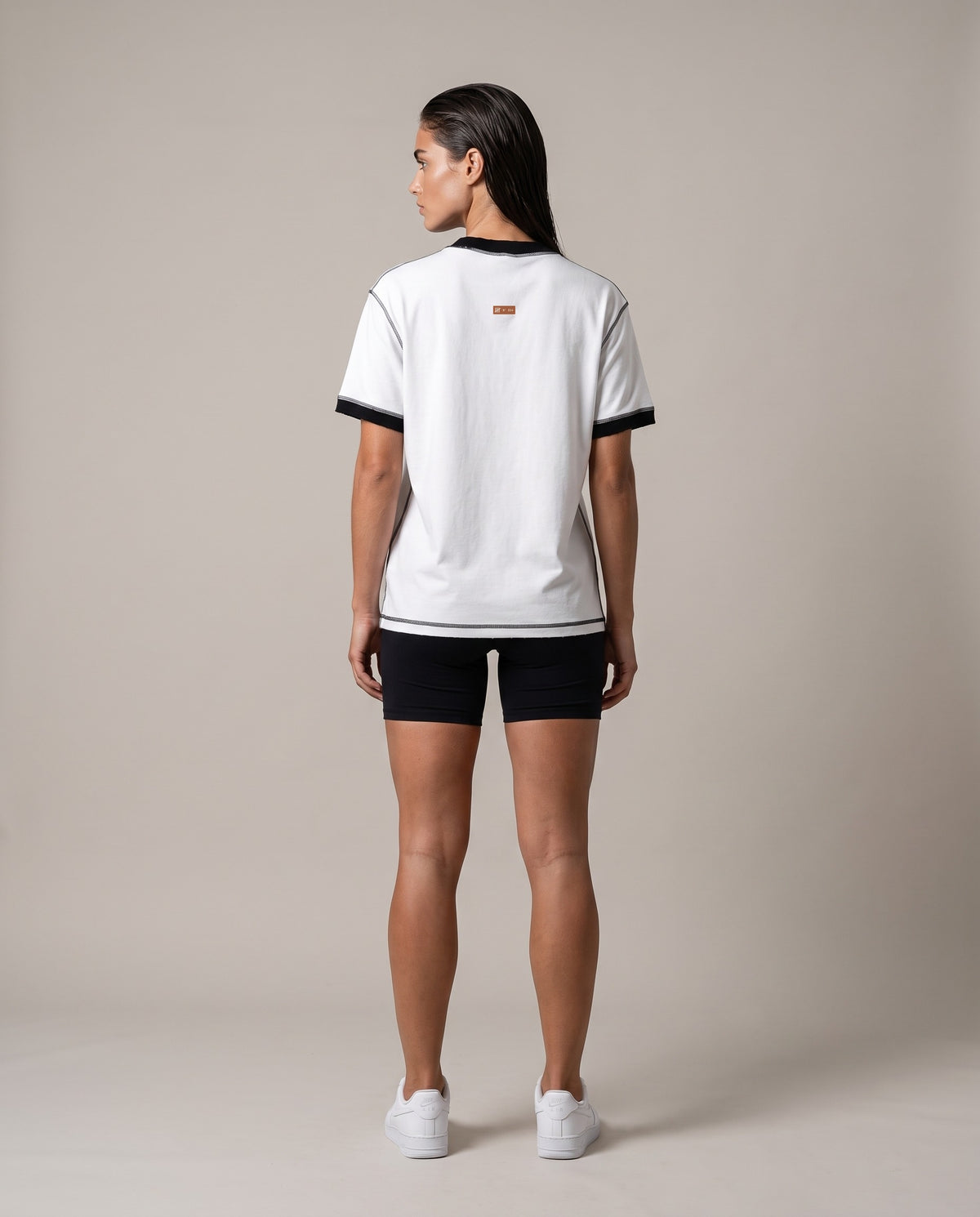 Running Club Ringer Tee — White with Black, back, worn by an ENDUR model