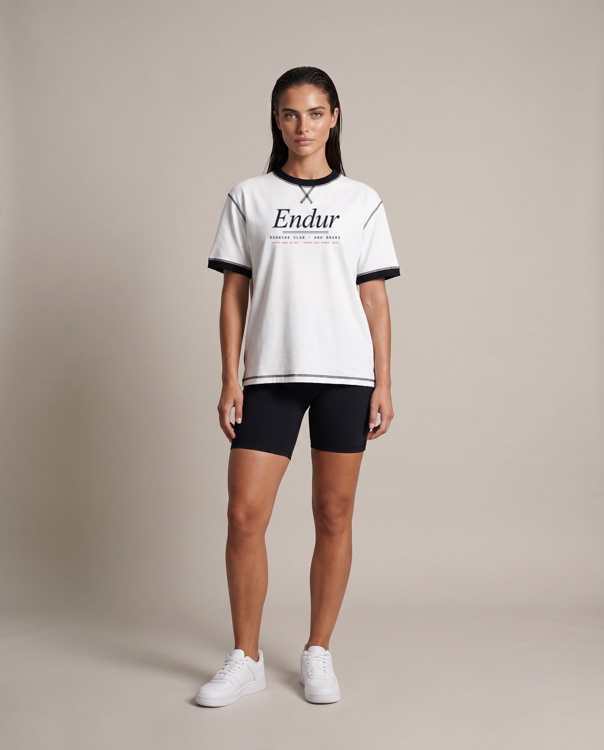 Running Club Ringer Tee — White with Black, front, worn by an ENDUR model