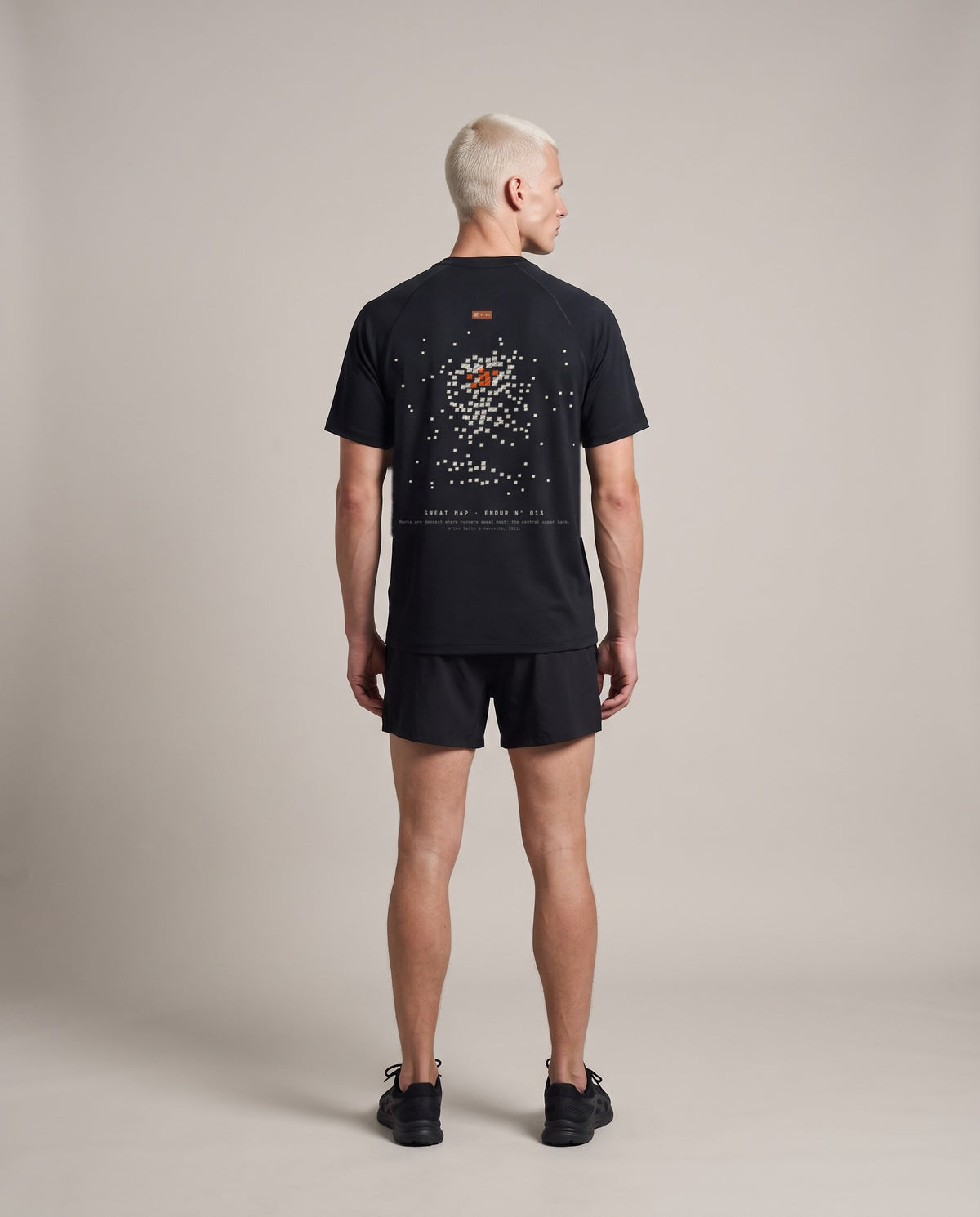 Sweat Map Run Tee — Black, back, worn by an ENDUR model