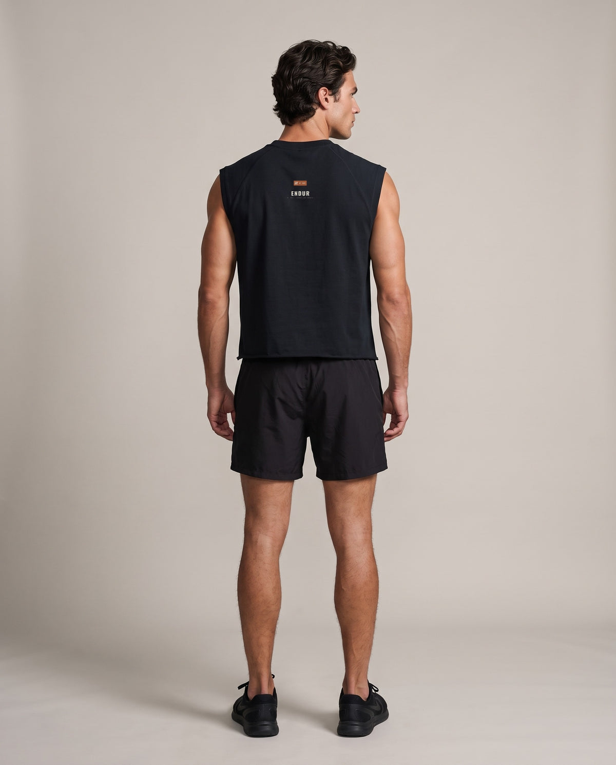 The Mark Boxy Tank — Black, back, worn by an ENDUR model