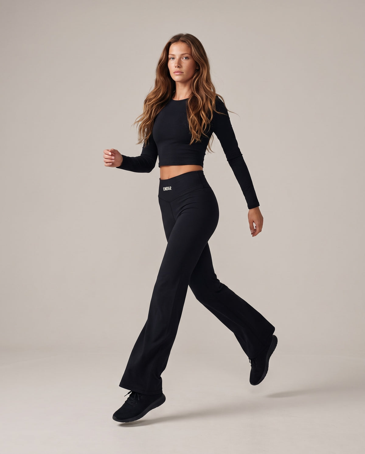 Off Day Flare Pants (Women's), in motion, worn by an ENDUR model
