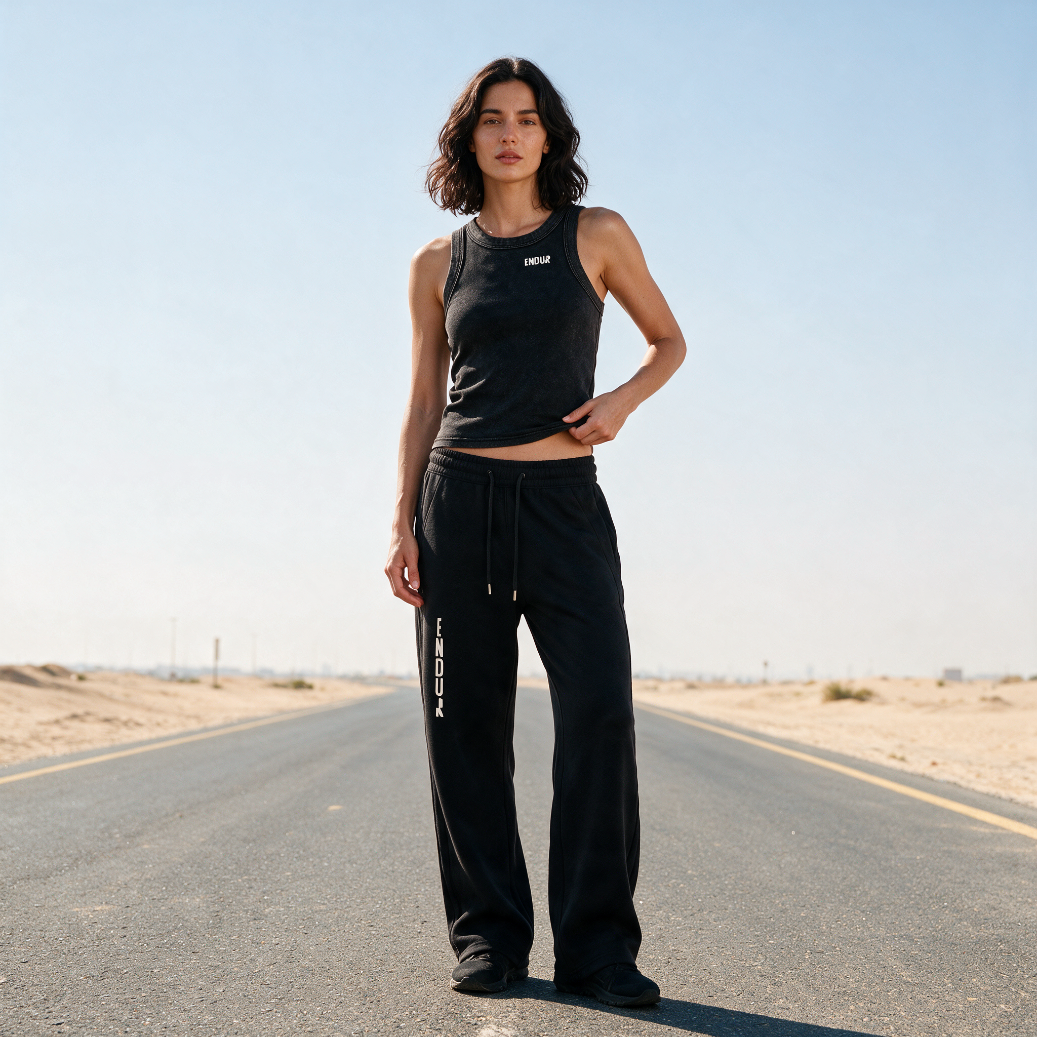 Model wearing the ENDUR Snow Wash Crop Tank Top, styled view