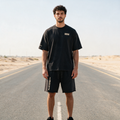 Model wearing the ENDUR Snow Wash Raw Hem Shorts, front view
