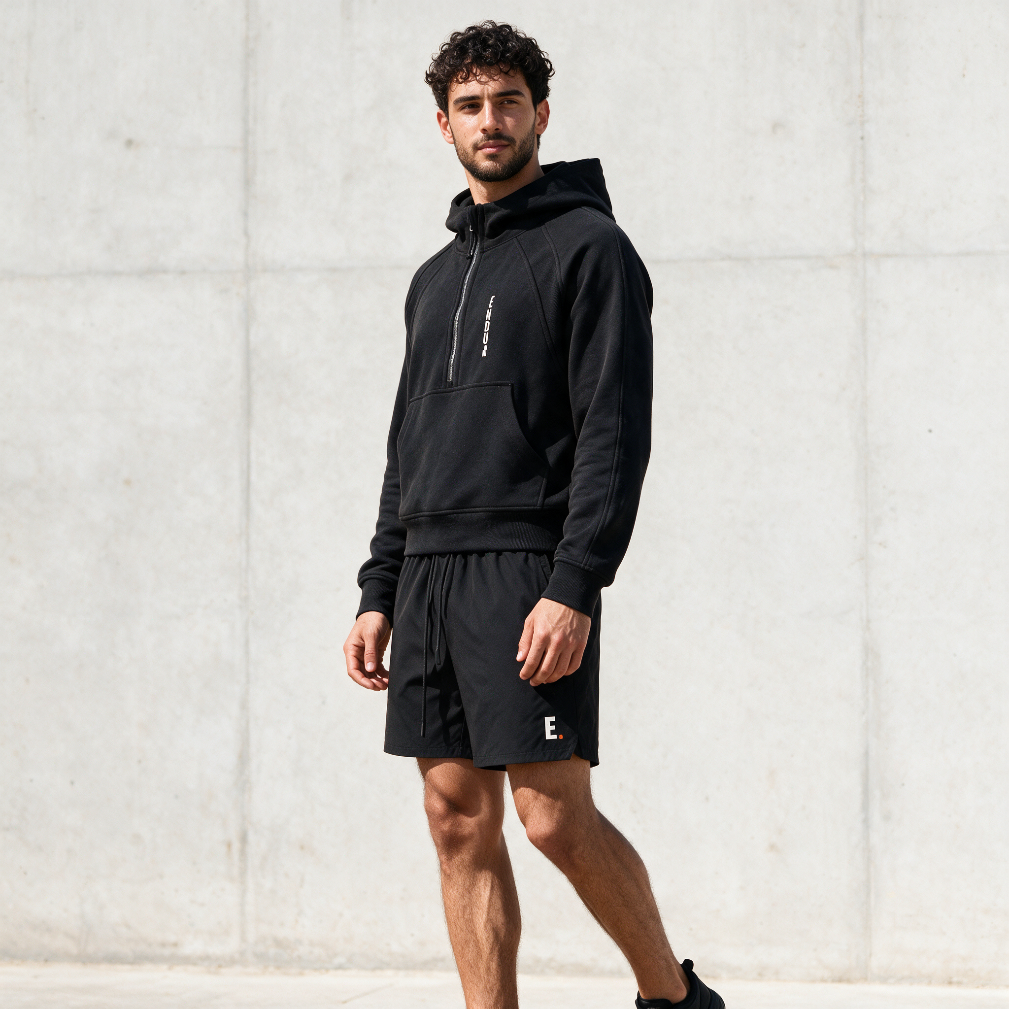 Model wearing the ENDUR Off Day Half-Zip, three quarter view