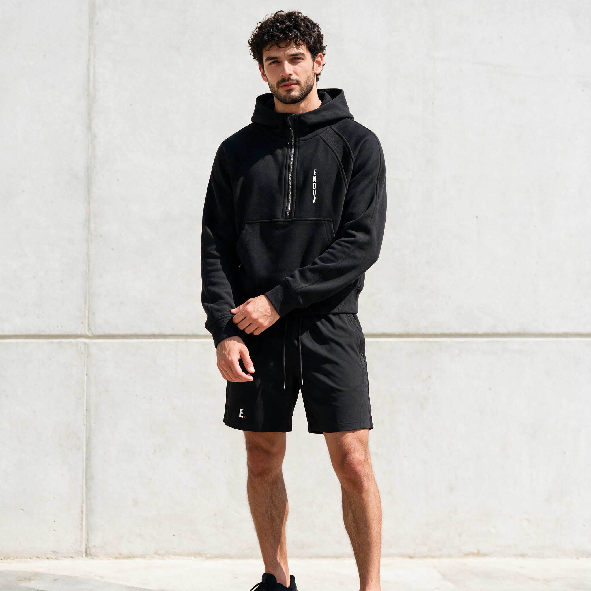 Model wearing the ENDUR Off Day Half-Zip, styled view