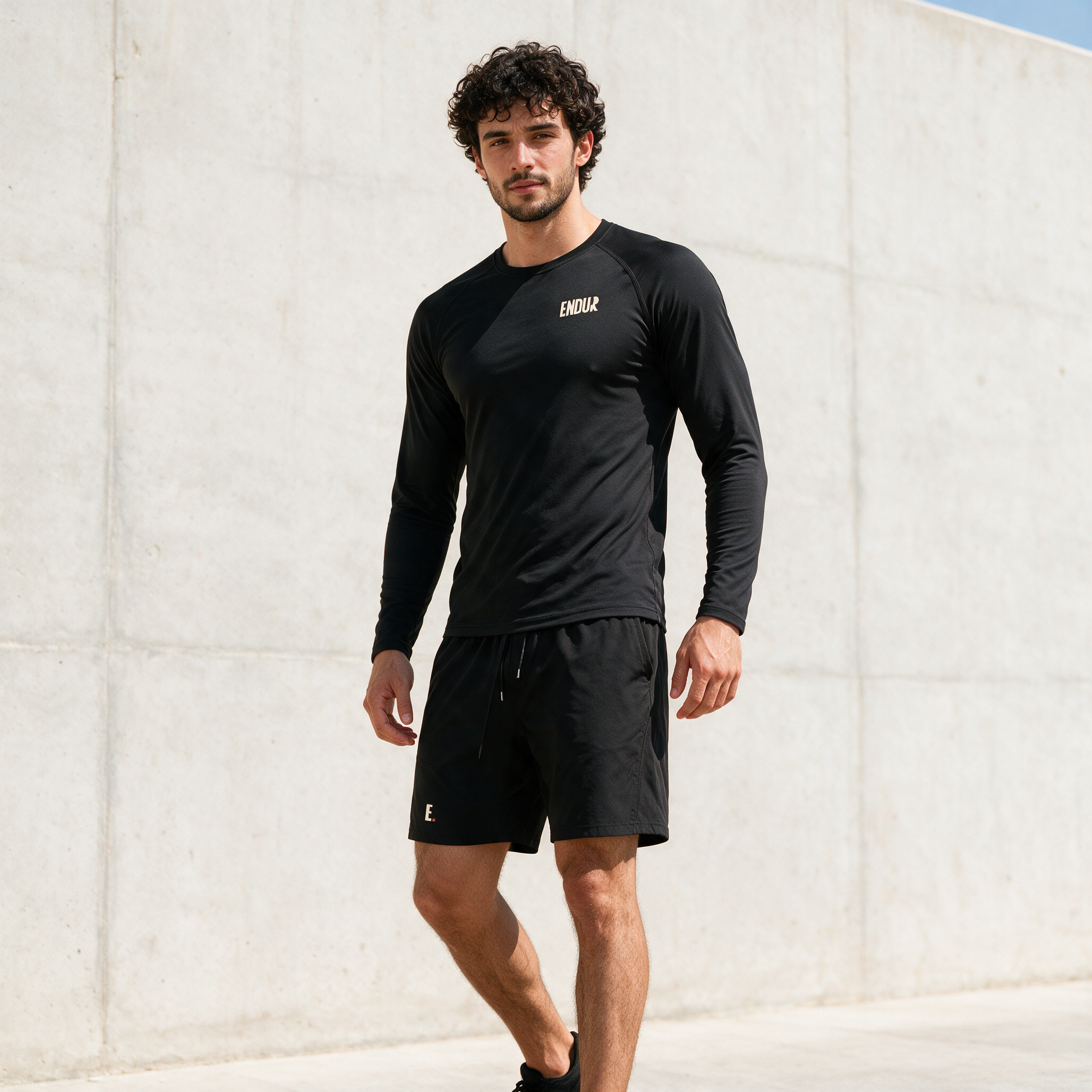 Model wearing the ENDUR Off Day Long Sleeve, three quarter view