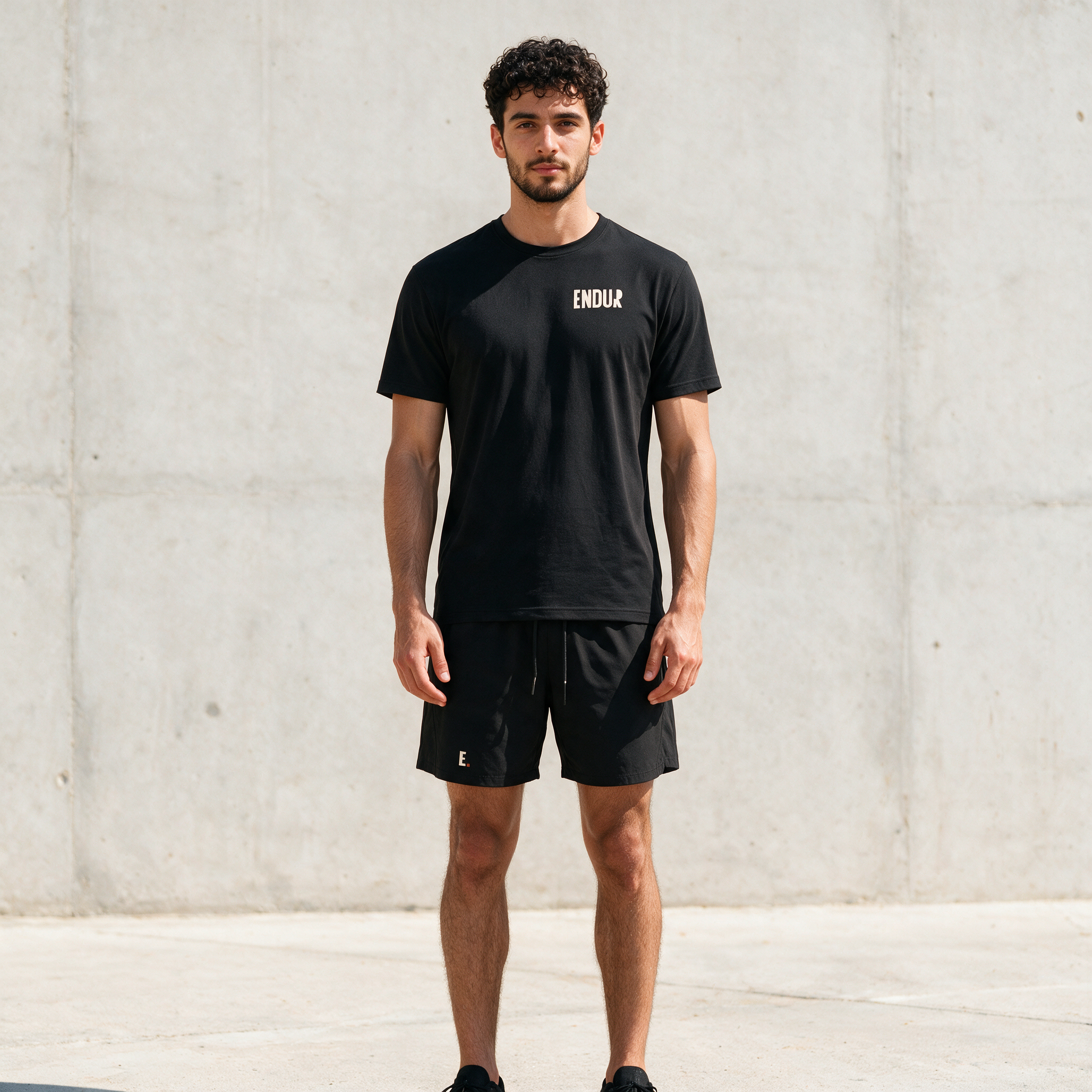 Model wearing the ENDUR Off Day Shorts, front view