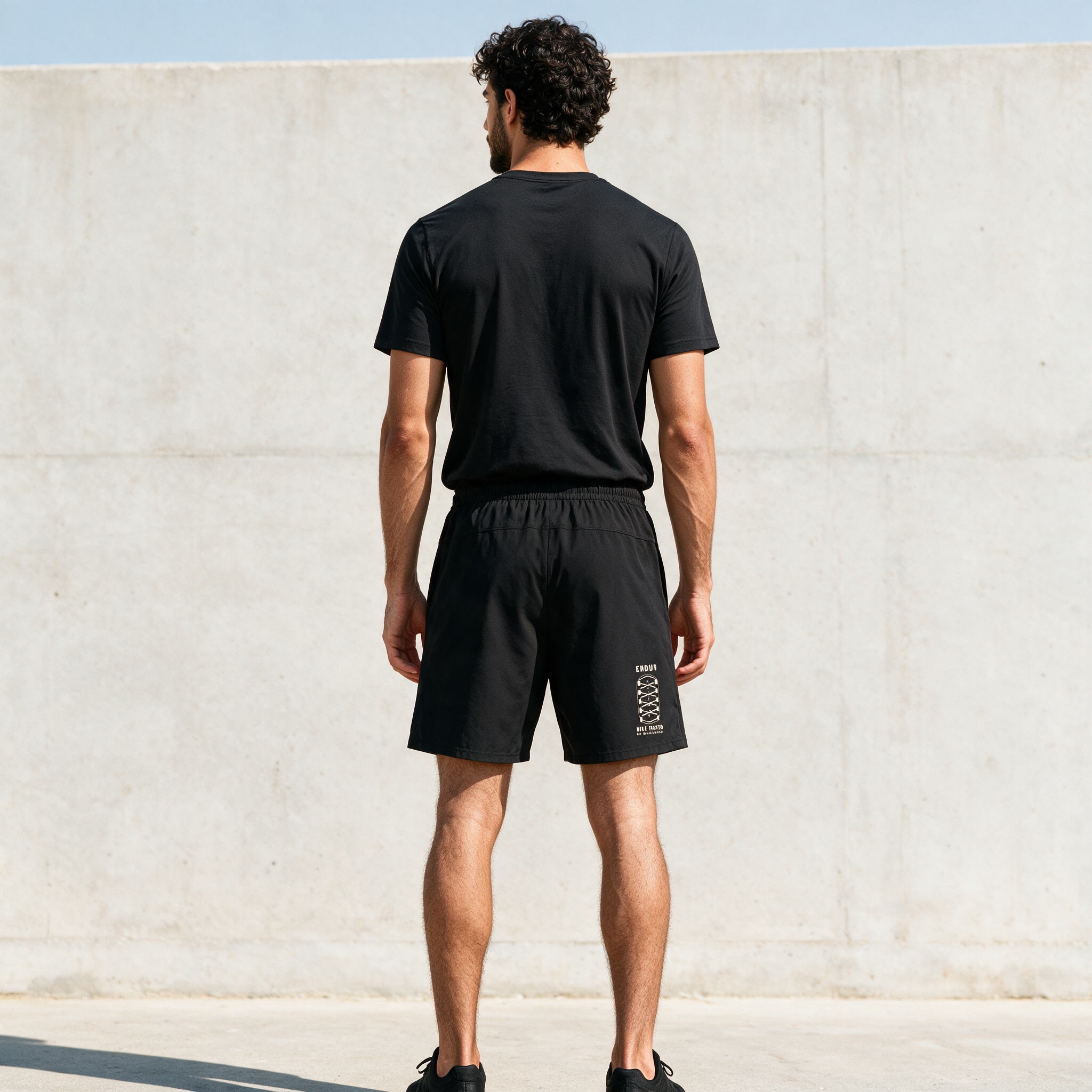 Model wearing the ENDUR Off Day Shorts, back view