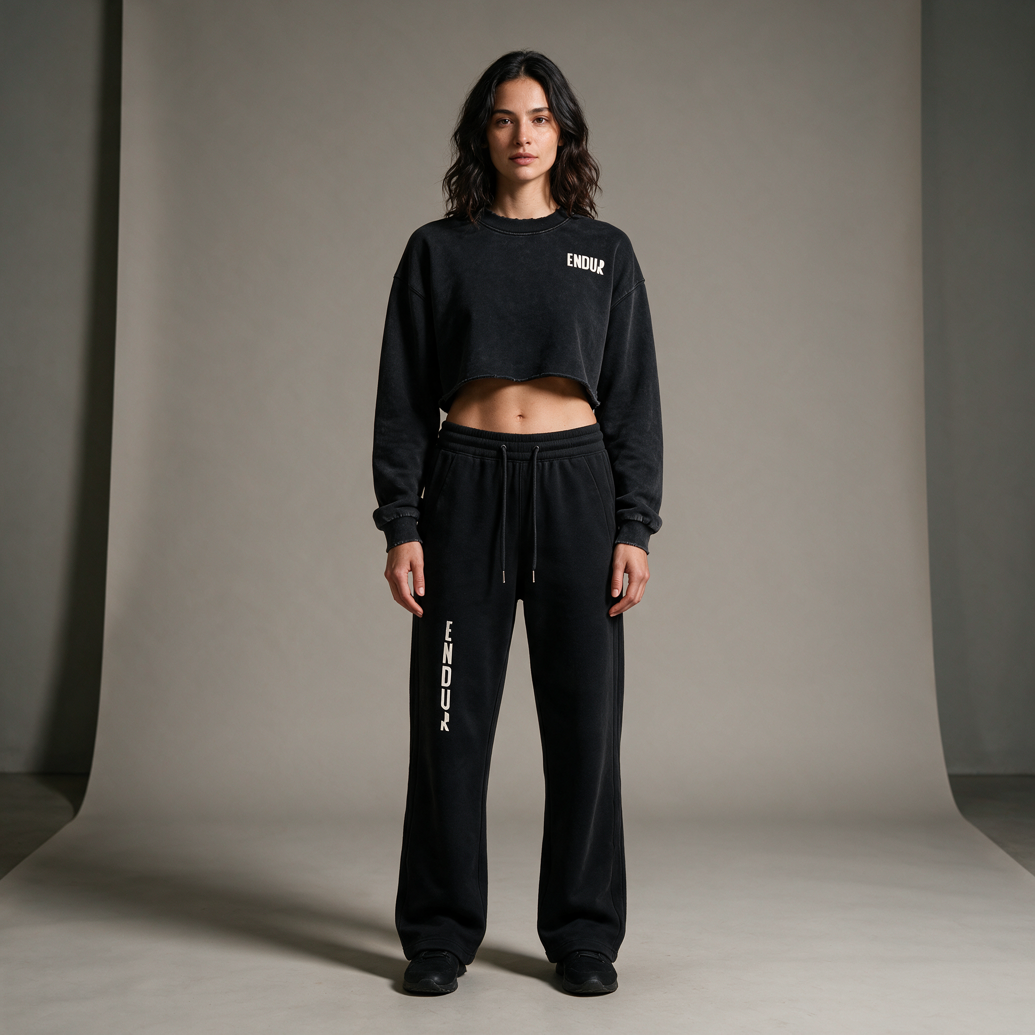 Model wearing the ENDUR Drawstring Straight-Leg Sweatpants, studio front view