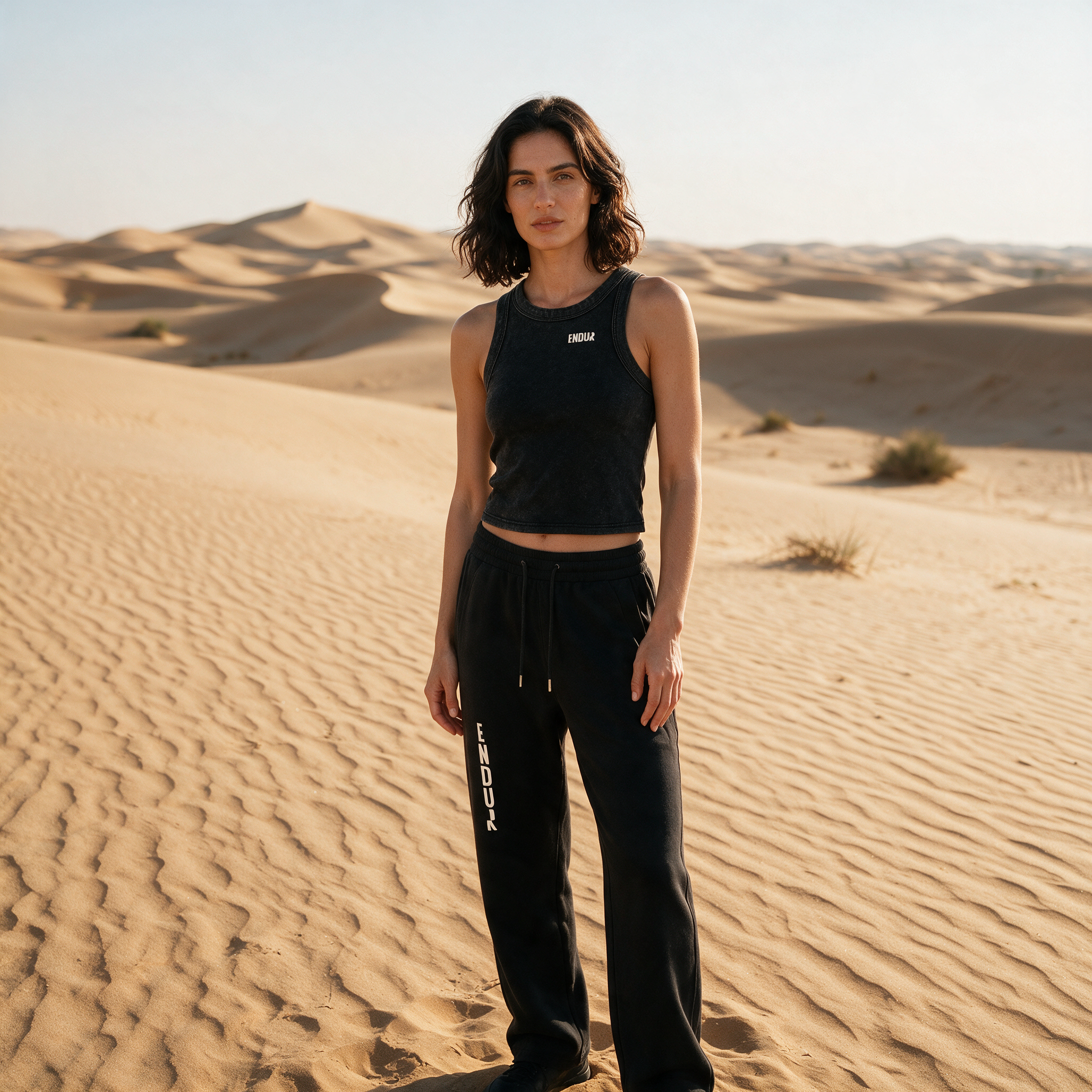Model wearing the ENDUR Snow Wash Crop Tank Top, in the desert