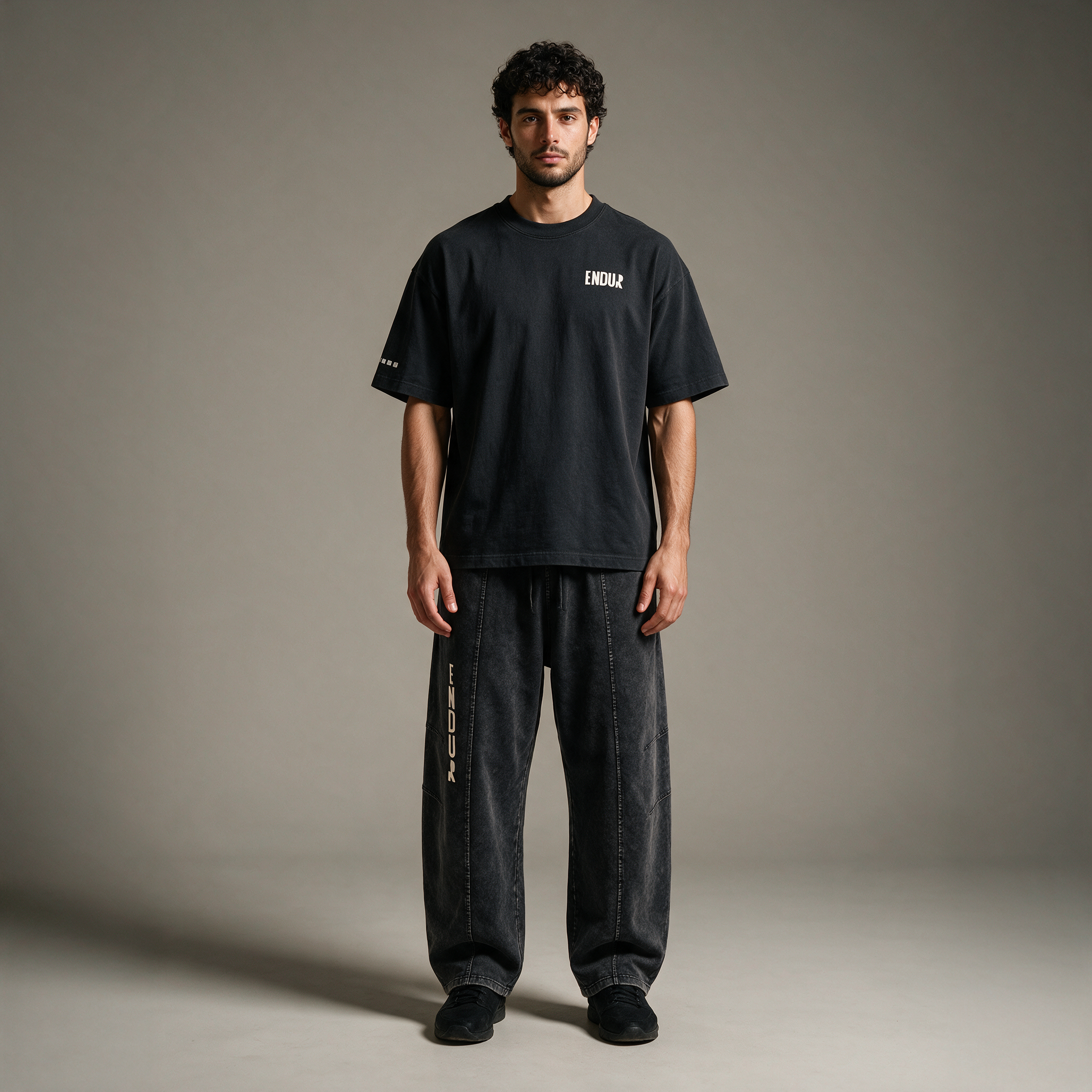 Model wearing the ENDUR Snow Wash Drawstring Pants, studio front view