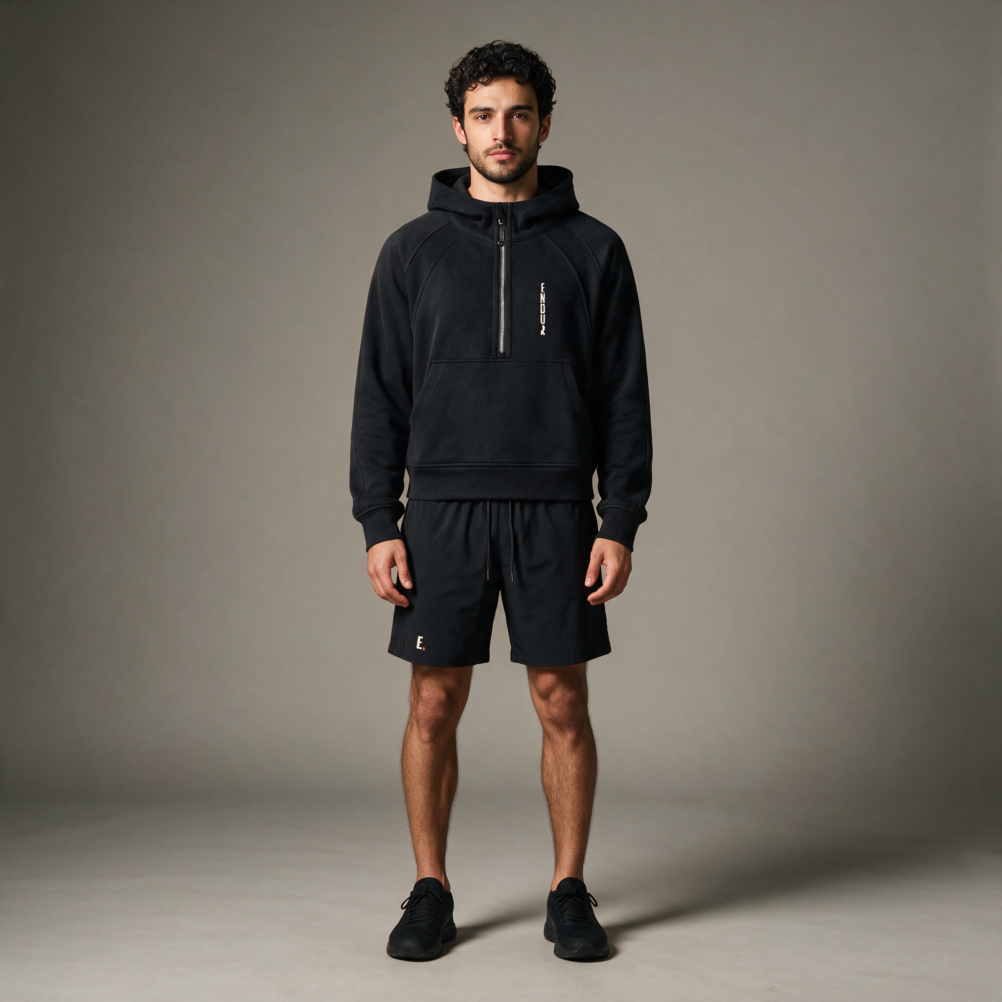 Model wearing the ENDUR Off Day Half-Zip, studio front view