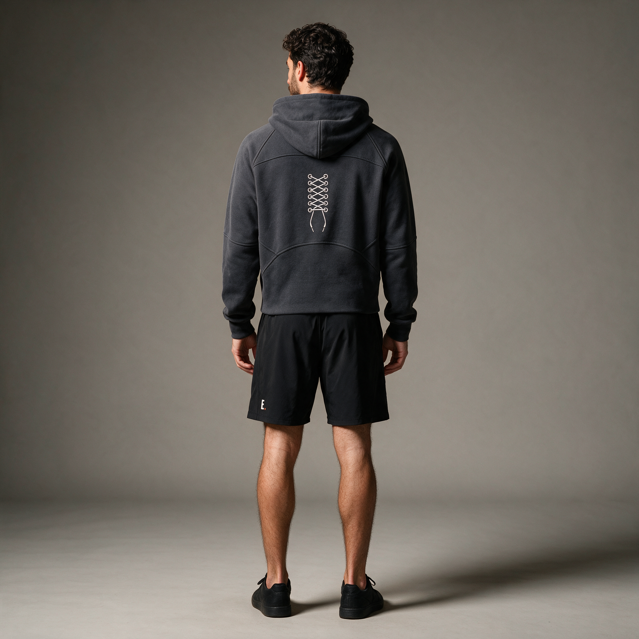 Model wearing the ENDUR Off Day Half-Zip, studio back view