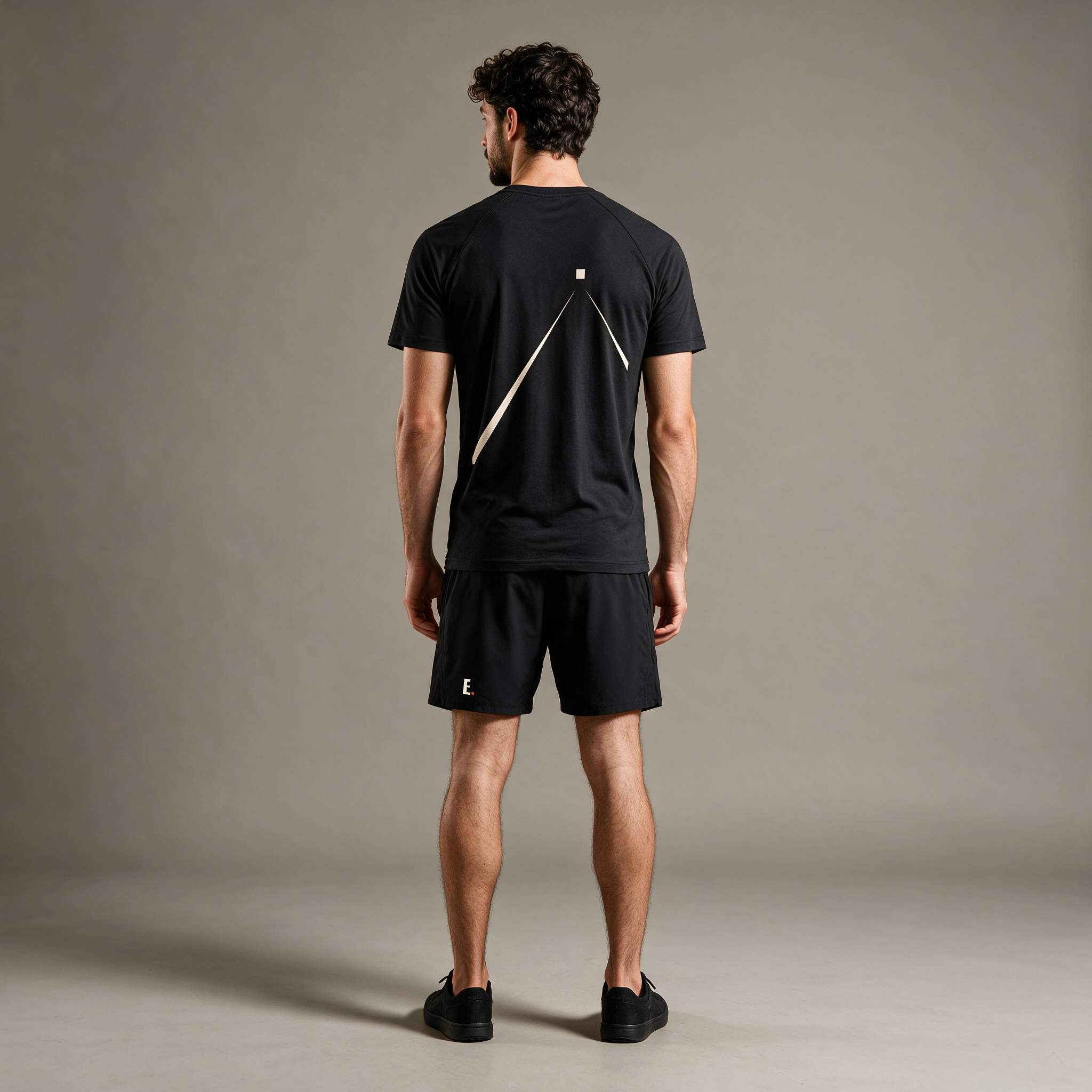 Model wearing the ENDUR Off Day Tee, studio back view