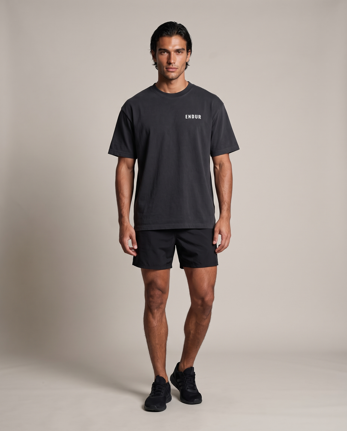 Load Drawing Oversized Tee — Black, front, worn by an ENDUR model