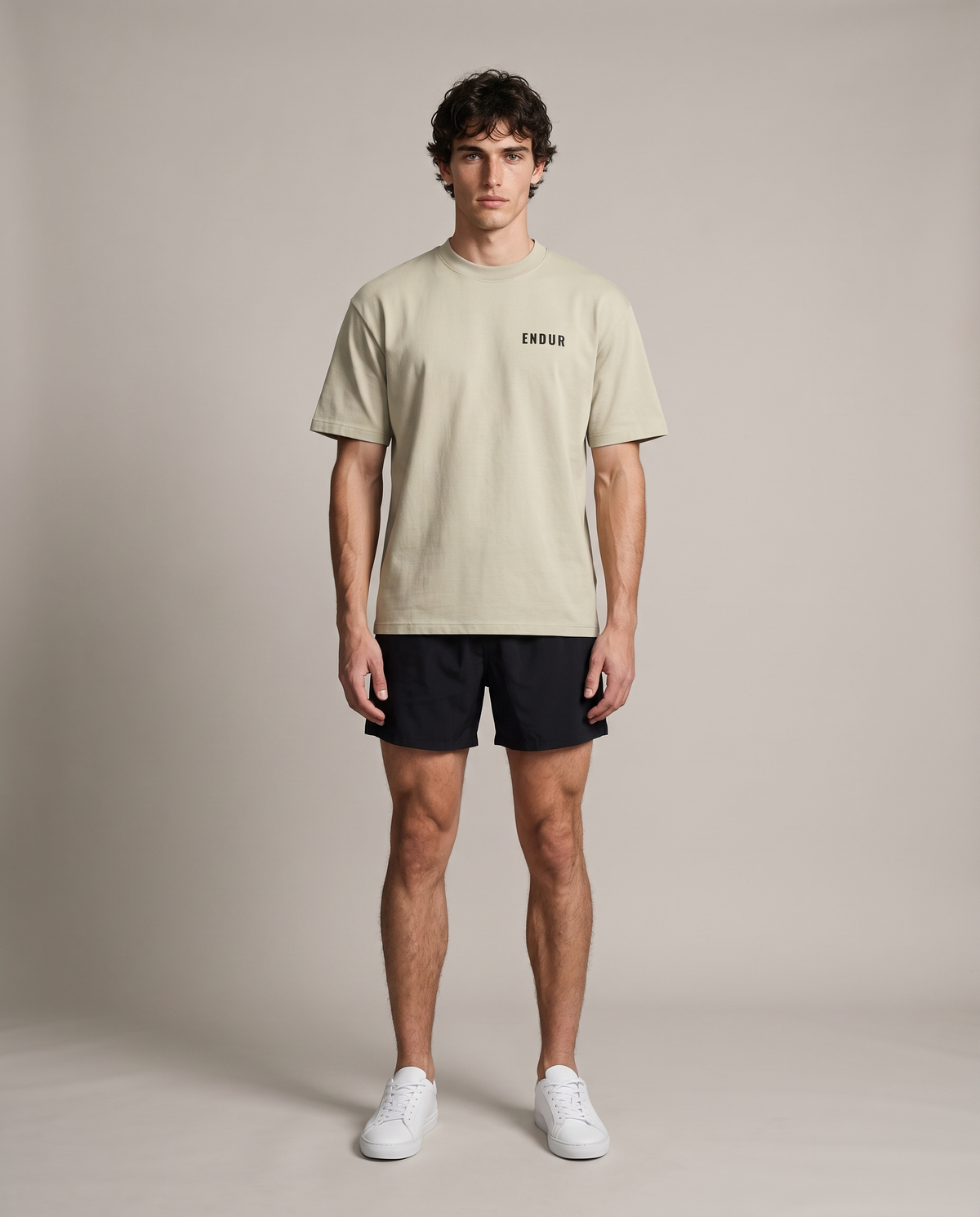 Off Day Protocol Tee — Sand, front, worn by an ENDUR model