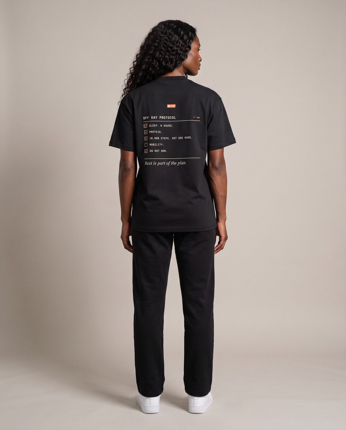 Off Day Protocol Tee — Black, back, worn by an ENDUR model