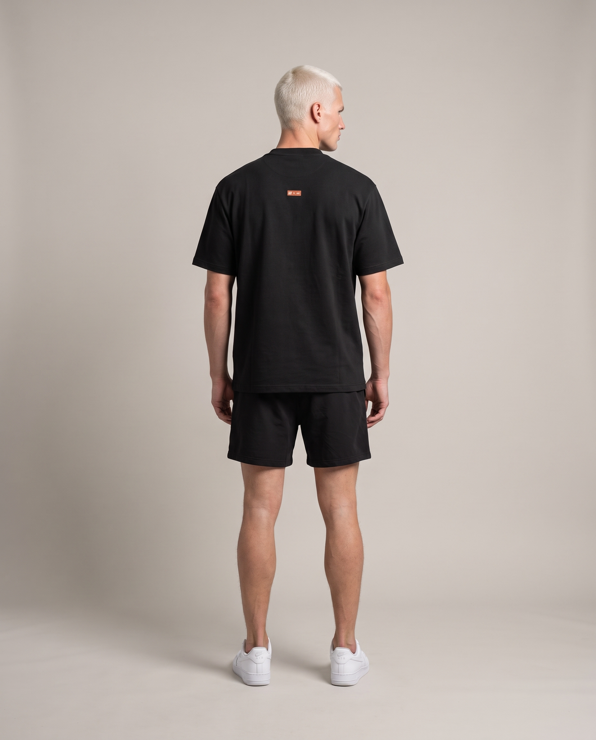Recovery Protocol Tee — Black, back, worn by an ENDUR model