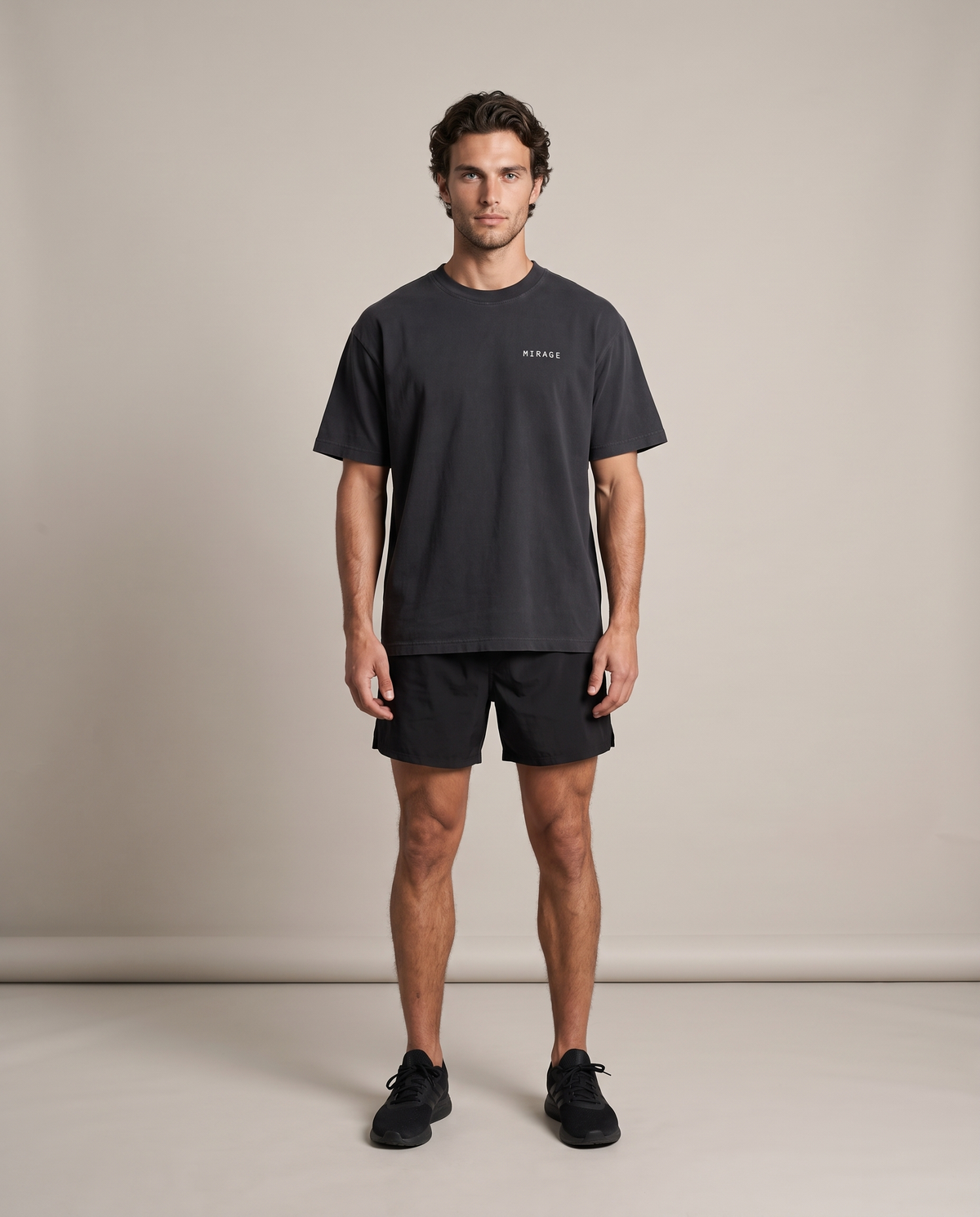 Mirage Oversized Tee — Black, front, worn by an ENDUR model