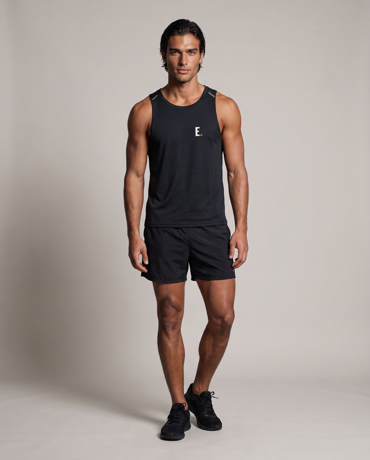 Heat Index Singlet — Black, front, worn by an ENDUR model
