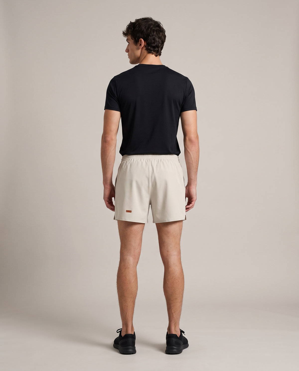 Liner Run Shorts — Pale Khaki, back, worn by an ENDUR model