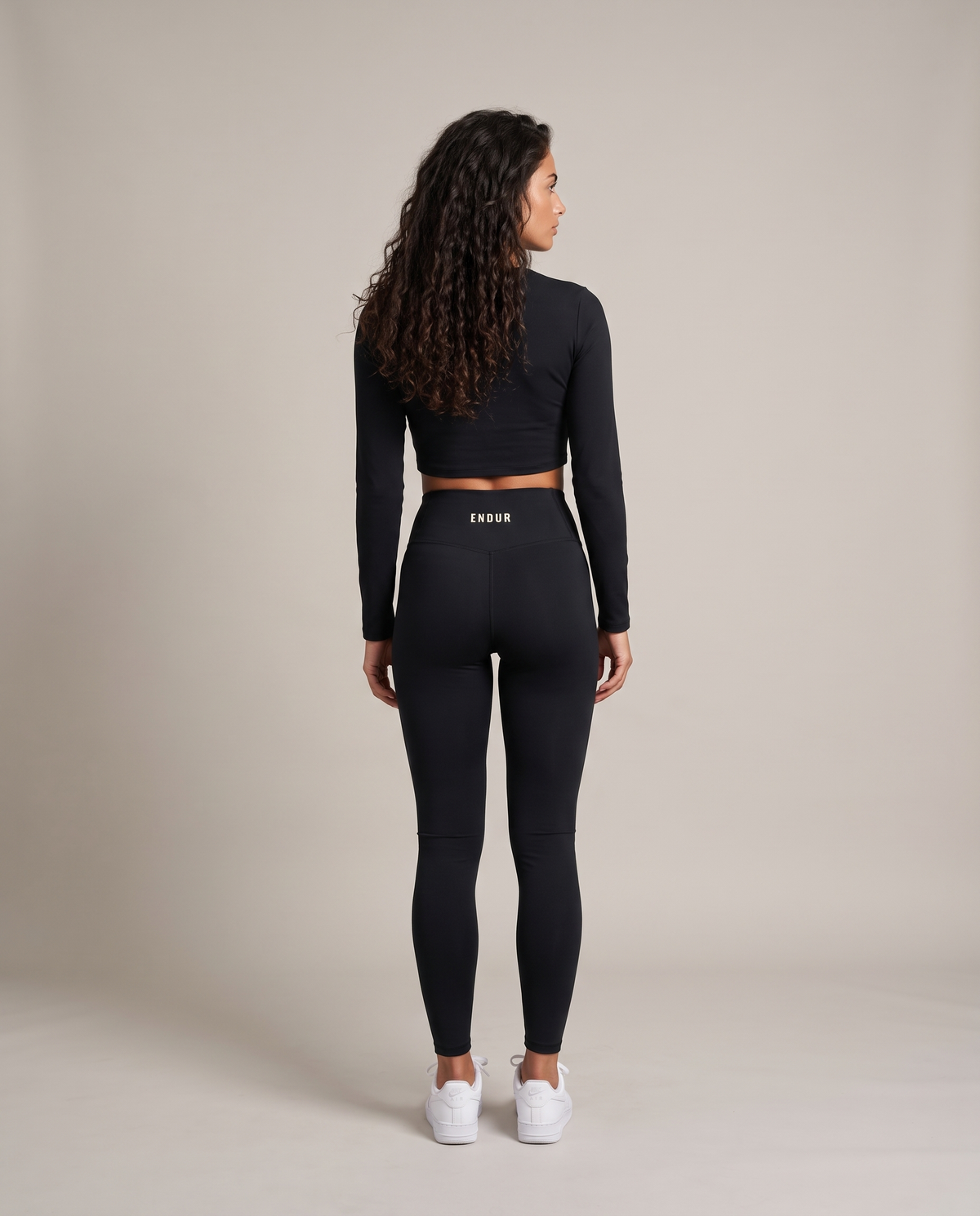 Off Day Leggings (Women's) — Black, back, worn by an ENDUR model